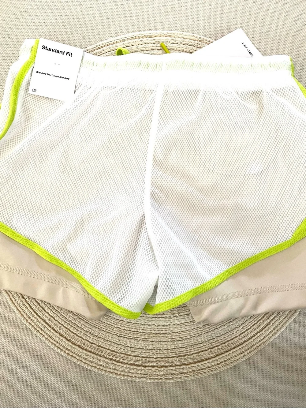 Nike Beige Sports Shorts with White Mesh Overlay and Neon Green Trim